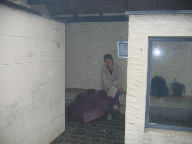 Scenic Bourscheid bus shelter with damp intrepid traveler